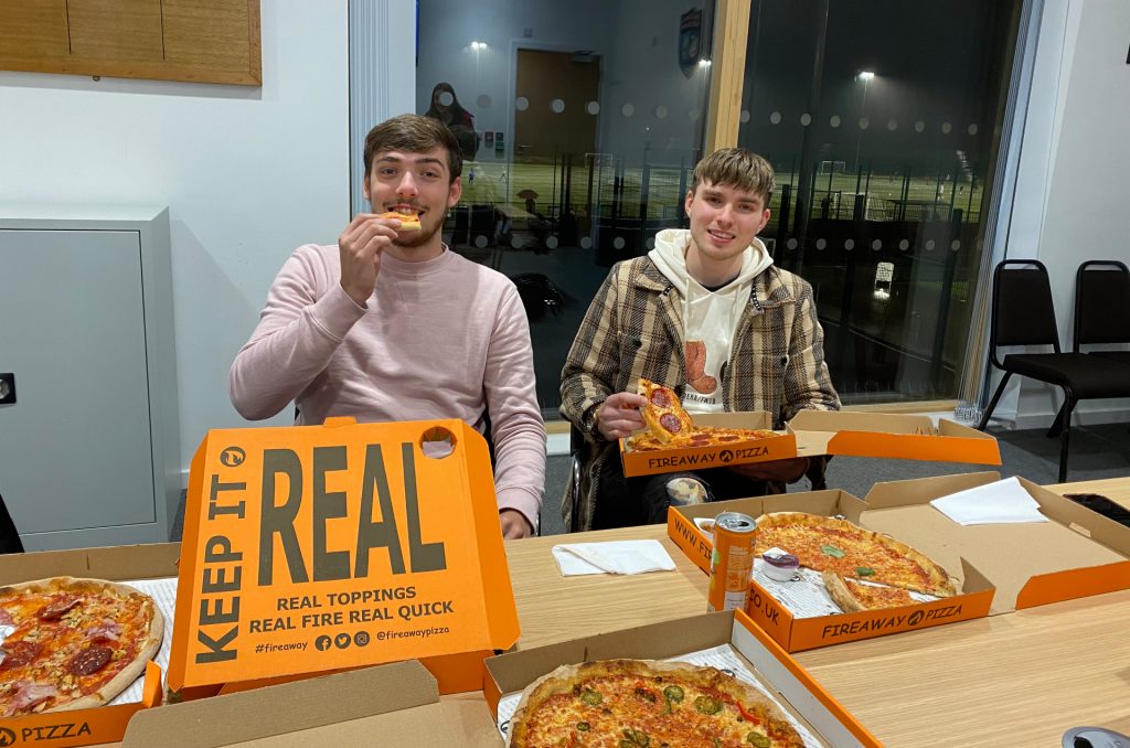 Youth forum attendees eating pizza_crop